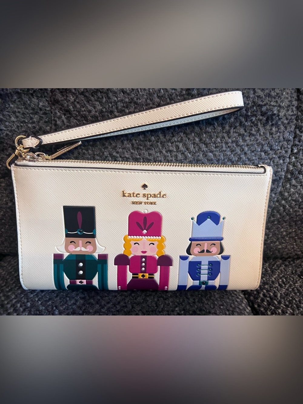 NWOT Kate Spade Cream wristlet with Nutcracker Appliqués! Never used.